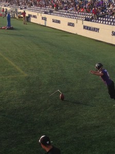Raven's kicker Justin Tucker practices his accuracy nearly in-line with the goal post.